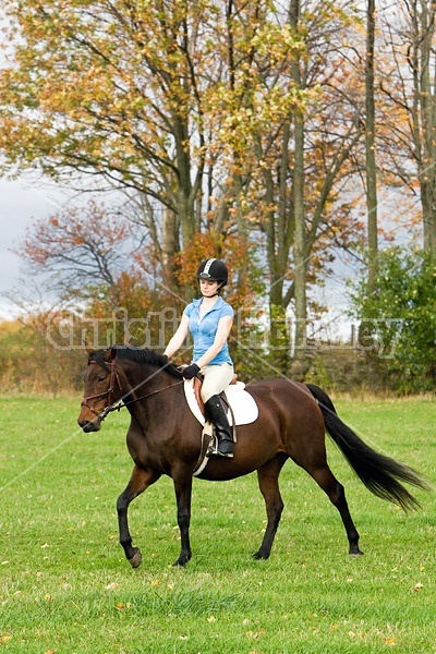 Young woman horseback riding