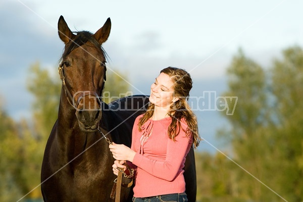 Young woman and her horse