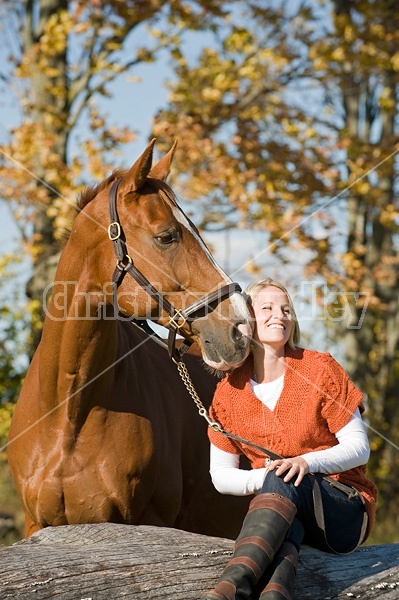 Young woman with her horse