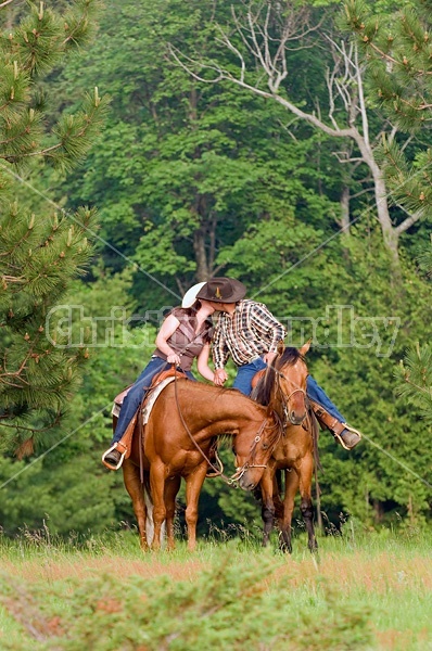 Young couple horseback riding