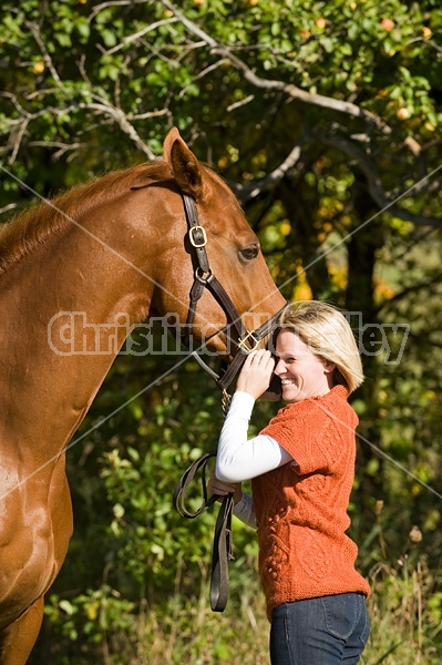 Young woman with her horse