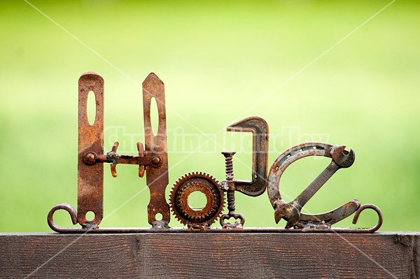 Hand crafted hope garden art sign made out of recycled or repurposed farm tools and machinery parts then welded together