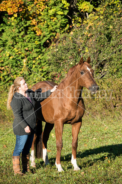 Woman with her Thoroughbred horse