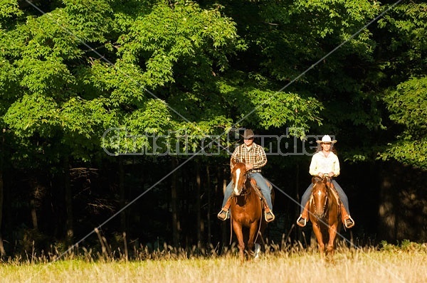 Husband and Wife Trail Riding Together