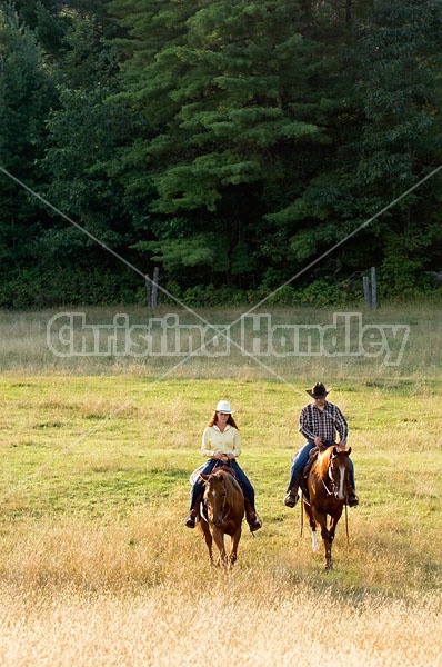 Husband and Wife Trail Riding Together