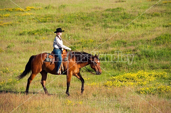 Young woman trail riding in Ontario Canada