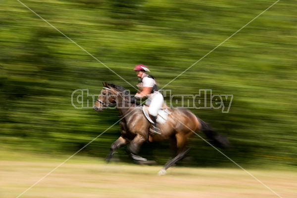 Woman riding cross country 