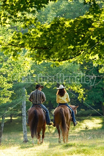 Husband and Wife Trail Riding Together