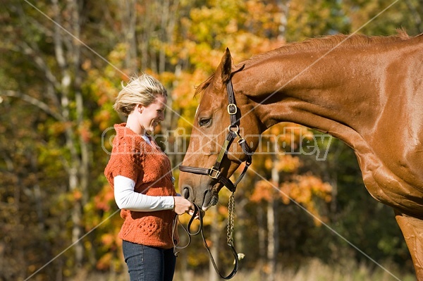 Young woman with her horse