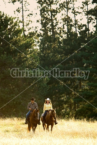 Husband and Wife Trail Riding Together