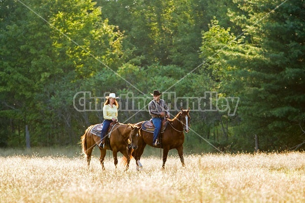 Husband and Wife Trail Riding Together