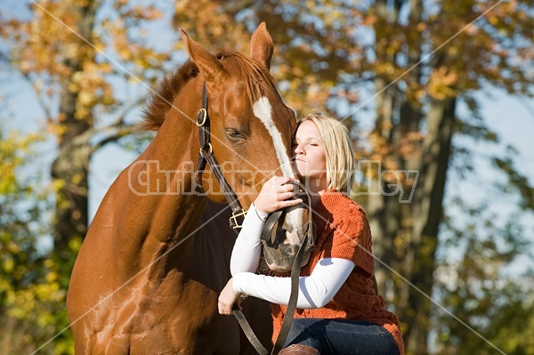 Young woman with her horse