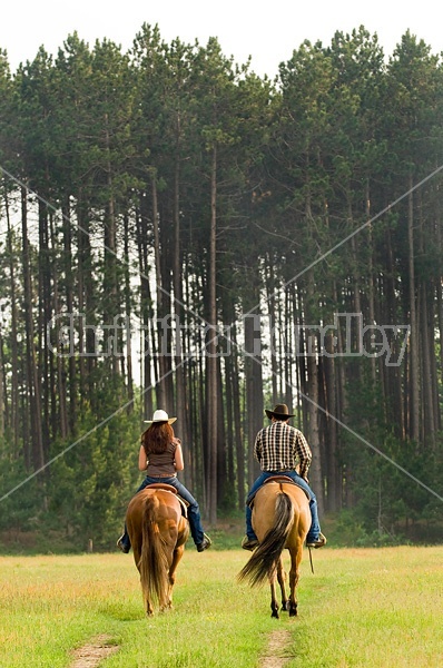 Young couple horseback riding