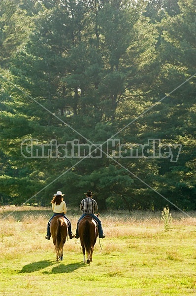 Husband and Wife Trail Riding Together