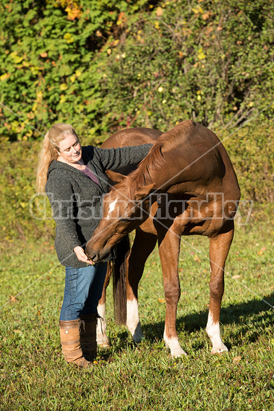 Woman with her Thoroughbred horse