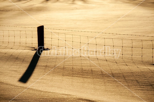 Photo of deep snow and page wire fence