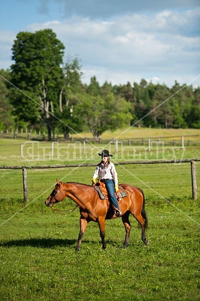 Young woman trail riding in Ontario Canada