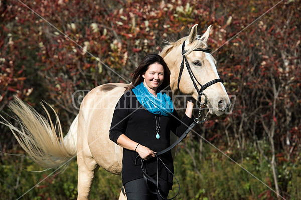 Woman with a palomino horse