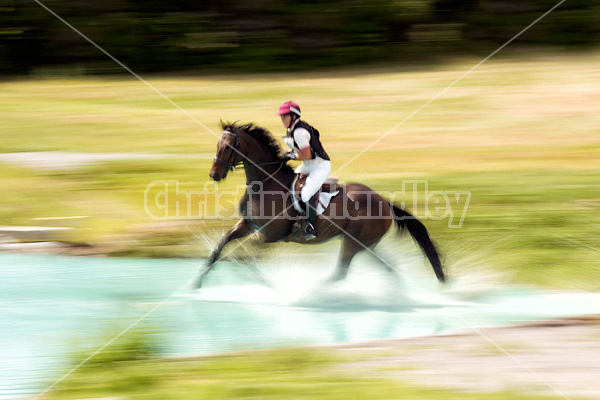 Woman riding cross country 