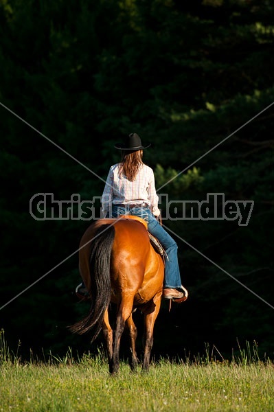 Young woman trail riding in Ontario Canada