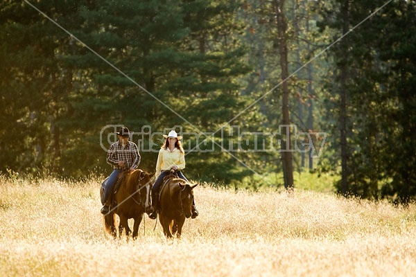 Husband and Wife Trail Riding Together