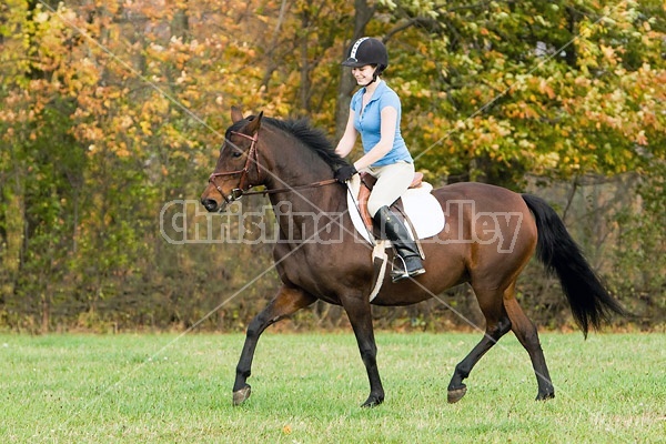 Young woman horseback riding