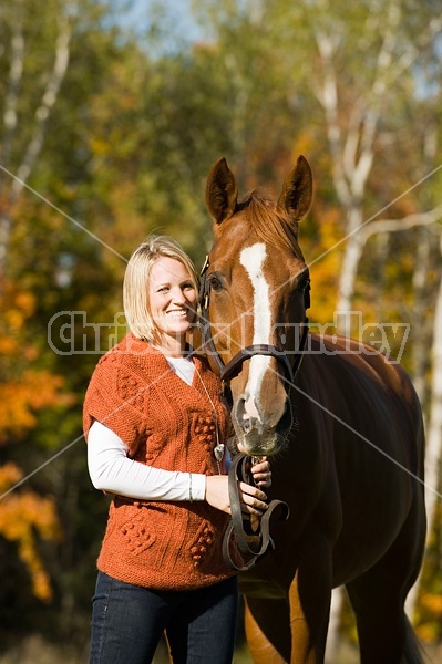 Young woman with her horse