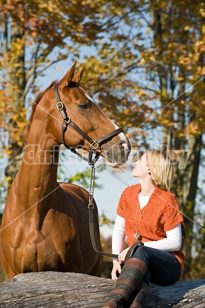 Young woman with her horse