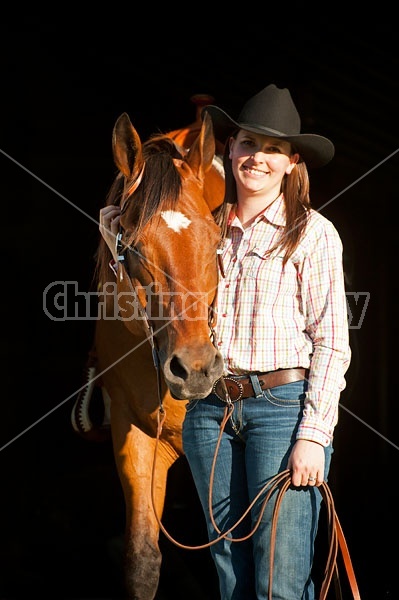 Portrait of a young woman and her American Quarter Horse gelding