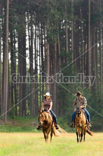 Young couple horseback riding