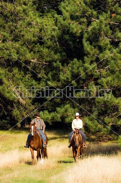 Husband and Wife Trail Riding Together