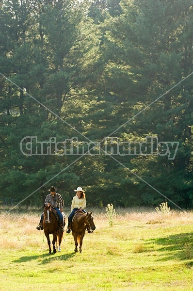 Husband and Wife Trail Riding Together