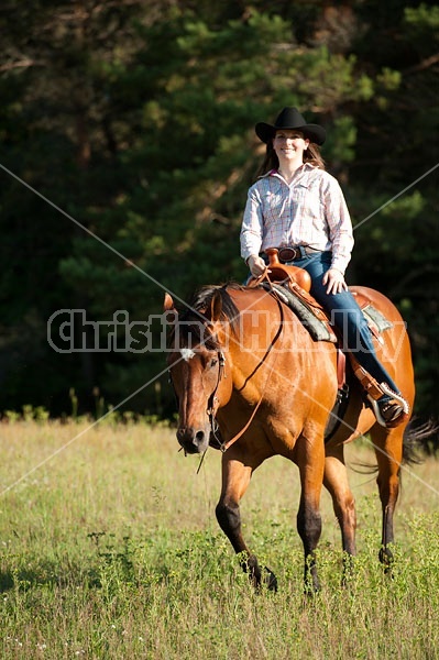 Young woman trail riding in Ontario Canada