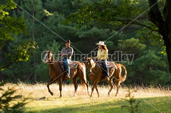 Husband and Wife Trail Riding Together