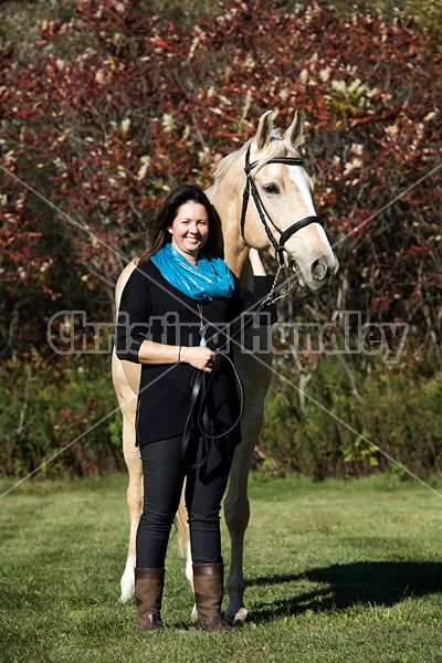 Woman with a palomino horse