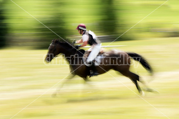 Woman riding cross country 