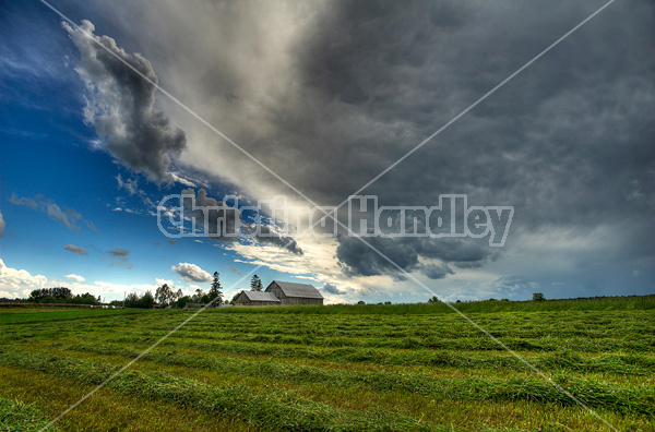 Summer storm moving in over farm