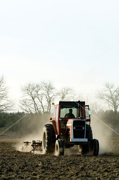 Farmer working a field in the springtime