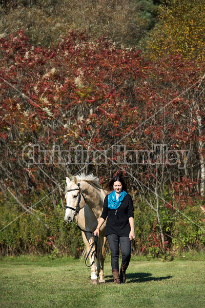 Woman with a palomino horse