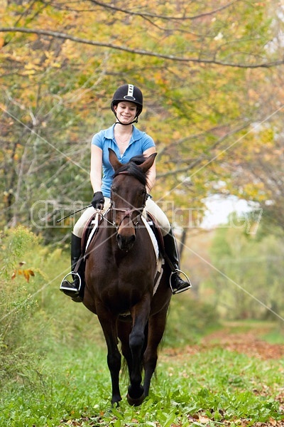 Young woman horseback riding