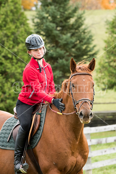 Portrait of young girl horseback riding