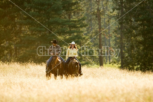 Husband and Wife Trail Riding Together