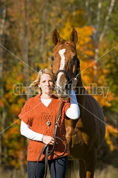 Young woman with her horse