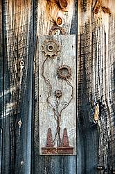 Hand crafted garden art sign made out of wood and recycled or repurposed farm tools and machinery parts