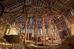Wide angle view of the inside of an old barns hayloft