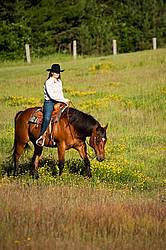 Young woman trail riding in Ontario Canada