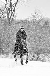 Woman horseback riding in the winter