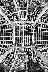 Looking straight up at the ceiling and rafters of the hayloft in an old style barn