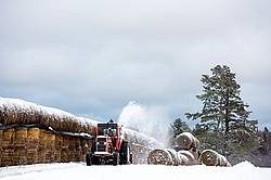 Farmer blowing snow out of driveway