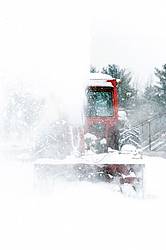 Snow blowing with tractor and snow blower